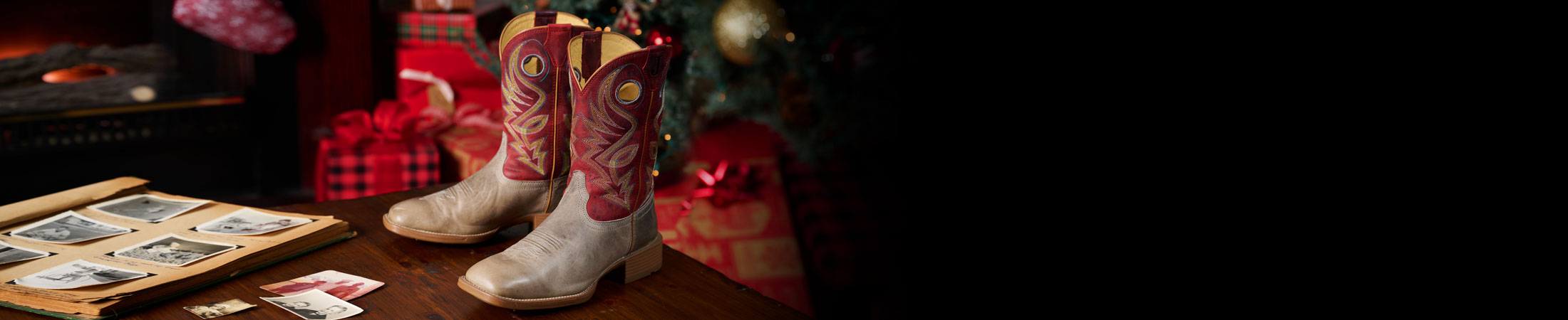 Pickett 11” Men’s Wide Square Toe in grey posed on a table with a Christmas background behind it.